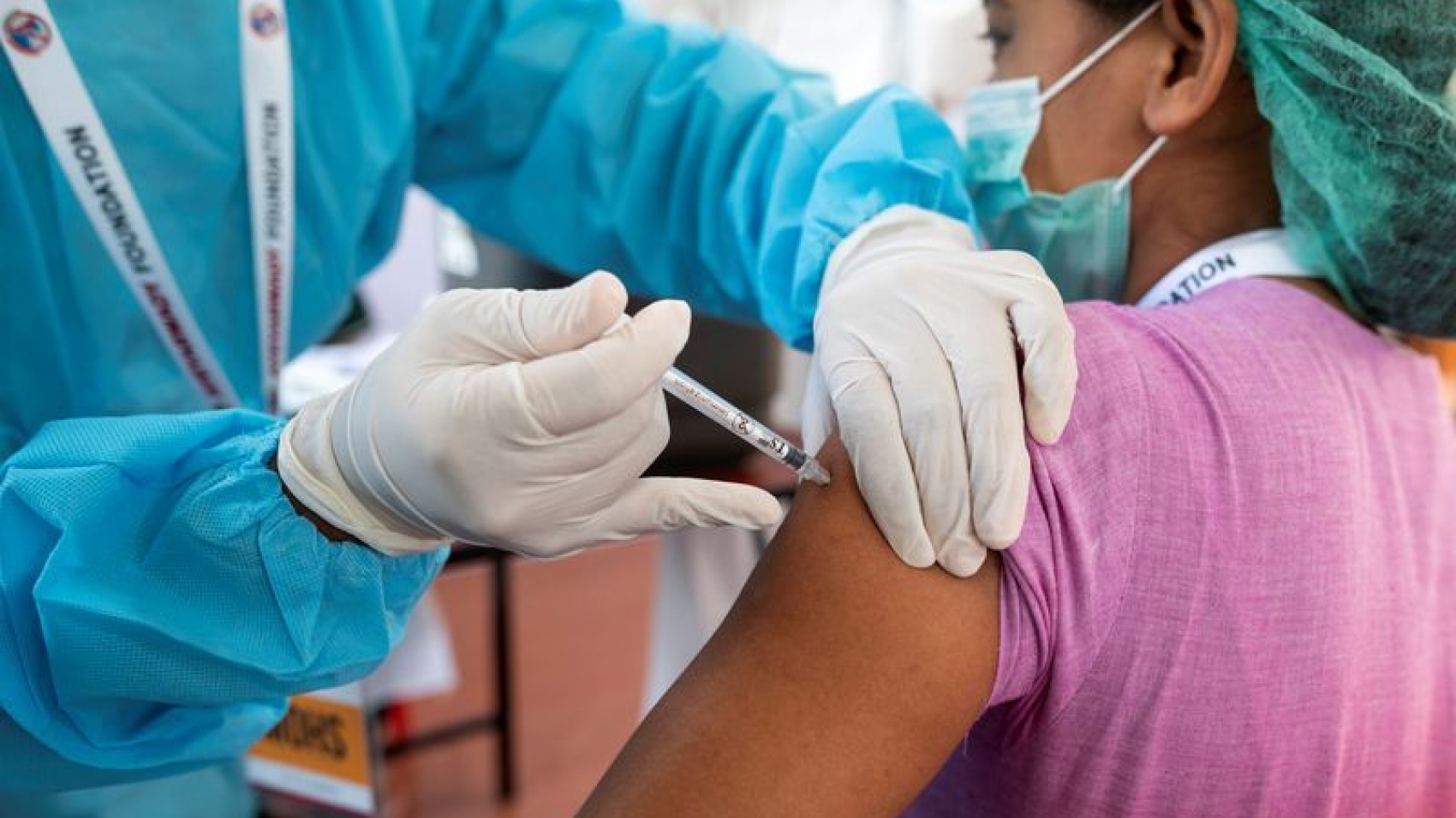 A medical worker receives the AstraZeneca's COVISHIELD coronavirus disease (COVID-19) vaccine in Yangon, Myanmar, after the country received 1.5 million doses of the vaccine manufactured by the Serum Institute of India, January 27, 2021. REUTERS/Shwe Paw Mya Tin