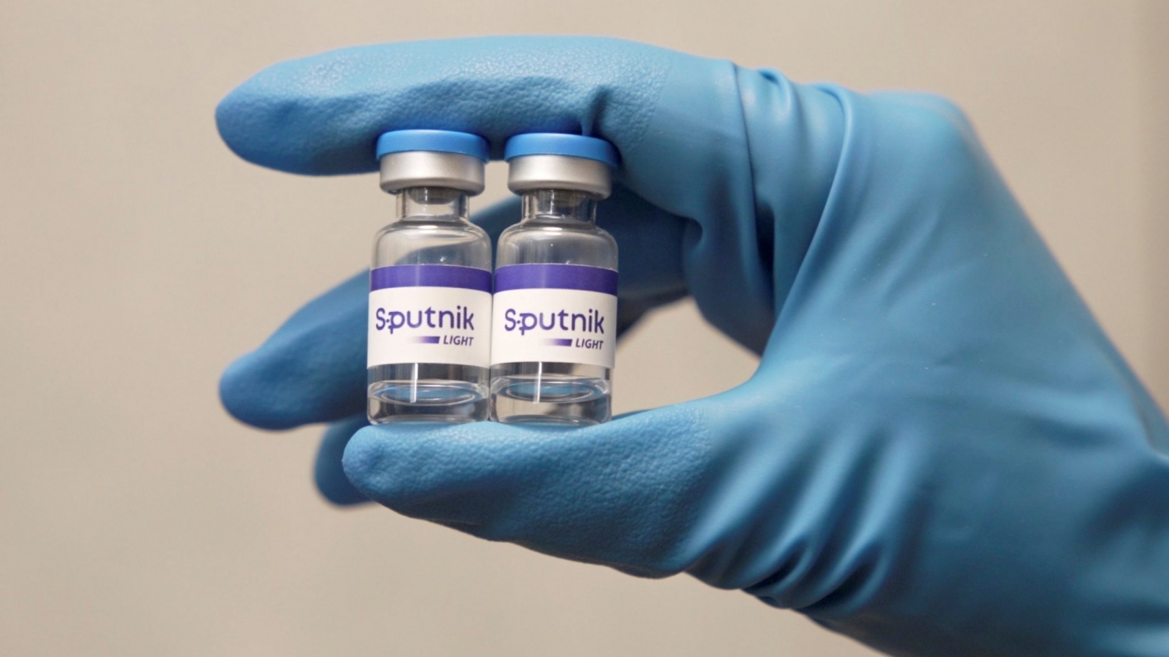 An employee demonstrates samples of Sputnik Light vaccine against the coronavirus disease (COVID-19) developed by the Gamaleya Research Institute of Epidemiology and Microbiology, in this still image taken from video released May 6, 2021 by the Russian Direct Investment Fund (RDIF). The Russian Direct Investment Fund (RDIF)/Handout via REUTERS